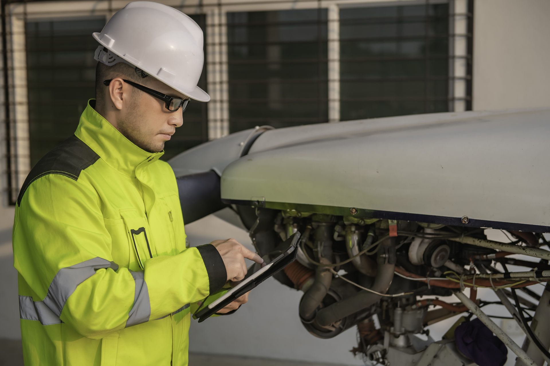 Engineer working on an open engine access panel