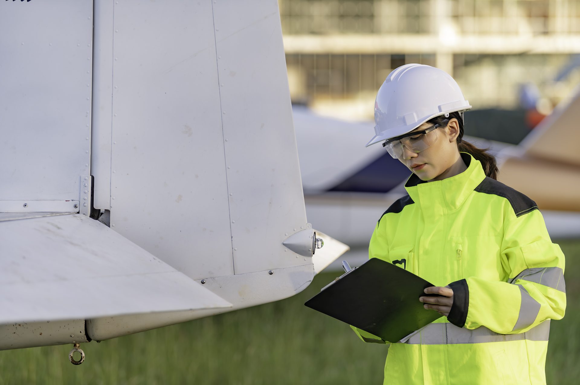 Engineer inspecting an aircraft wing