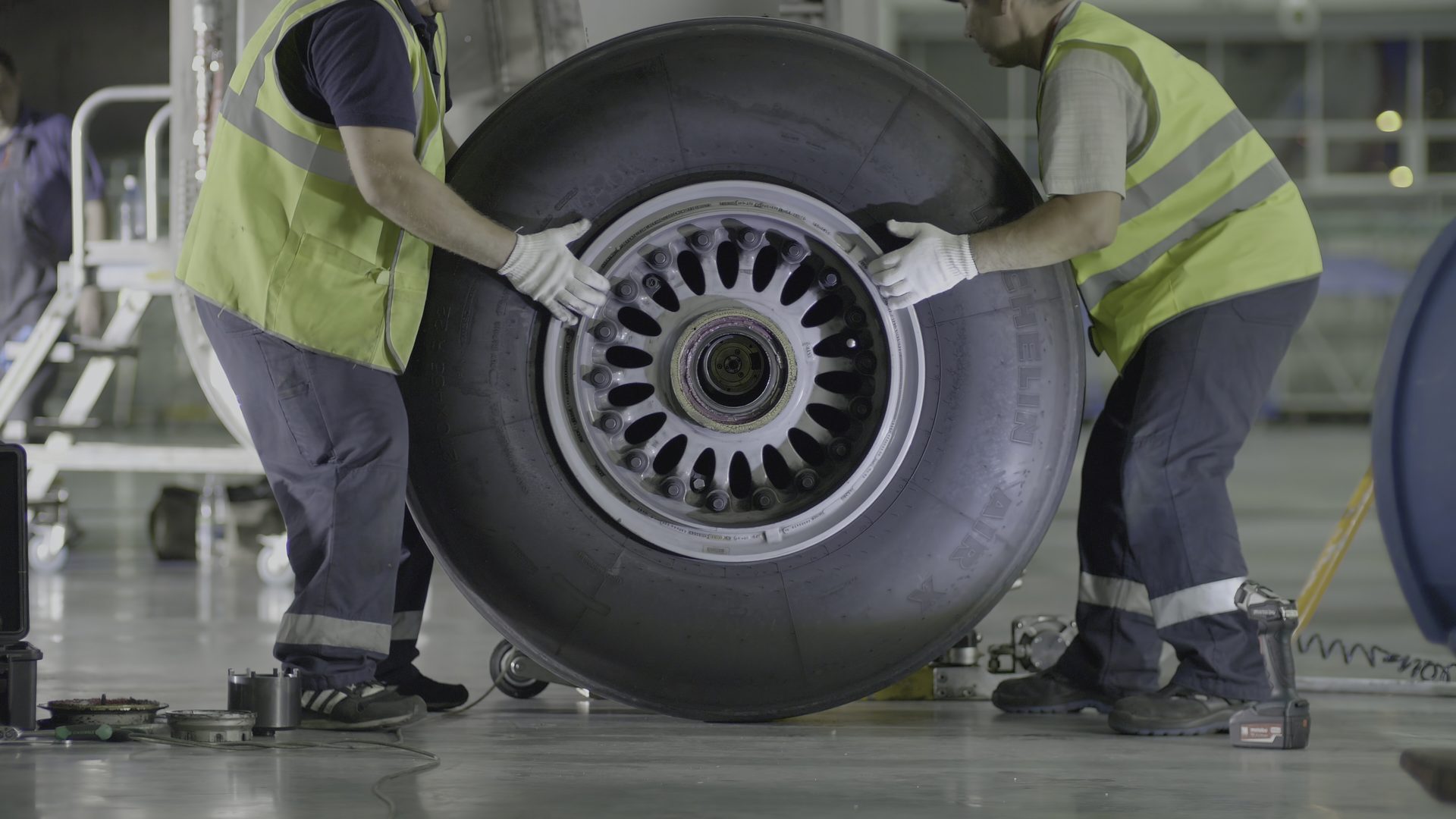 Technician working on an aircraft main landing gear